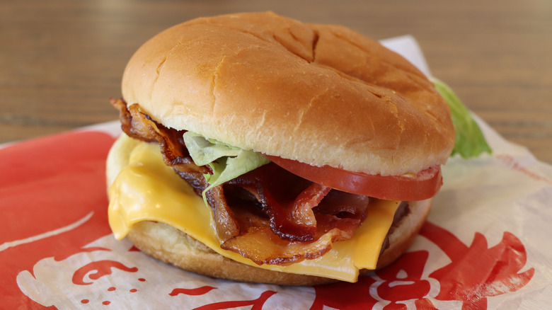 Wendy's junior bacon cheeseburger on branded wrapper