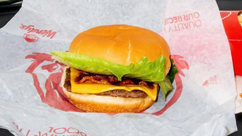 A junior bacon cheeseburger from Wendy's and an order of fries