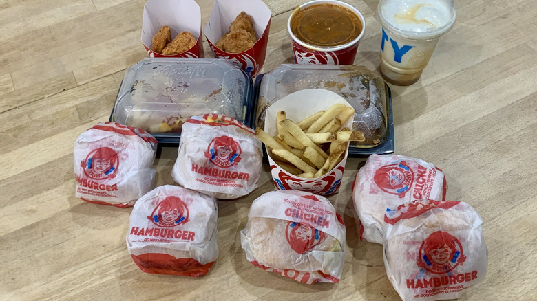Wendy's items in their packaging on wood table