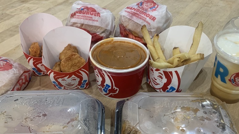 Wendy's items in their packaging on wood table