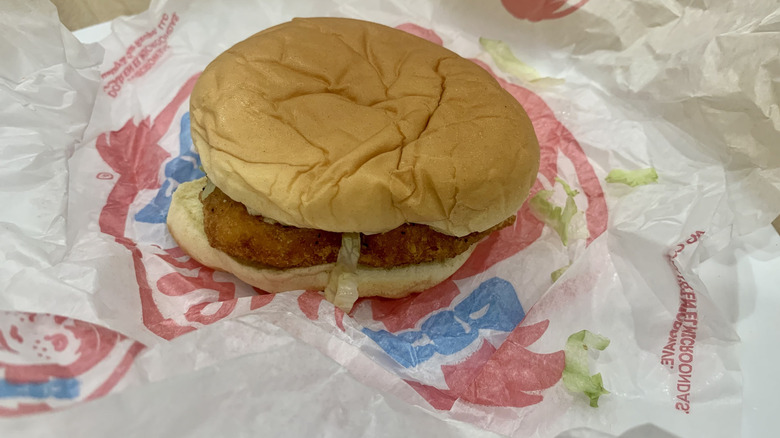 Crispy Chicken sandwich on top of paper wrapper
