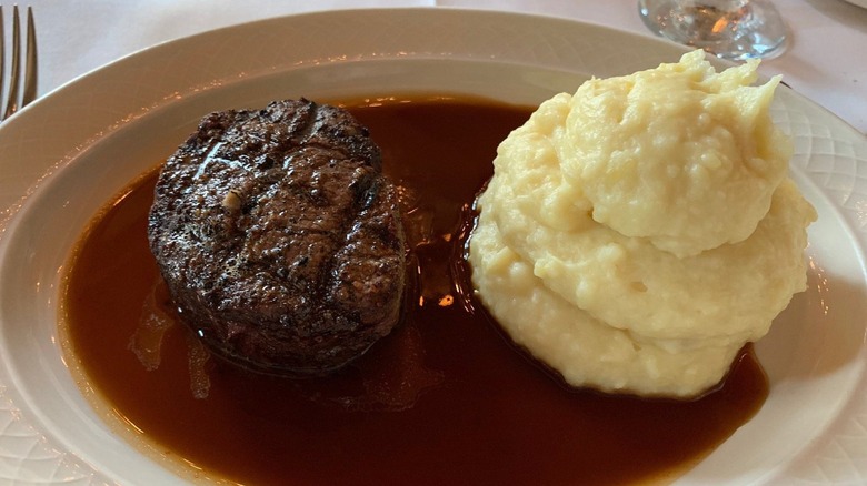 Filet on plate with pile of mash