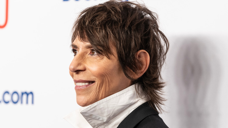 Side view of Dominique Crenn photographed at an event