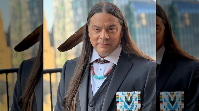 Sean Sherman in formal dress adorned with indigenous-American accesories