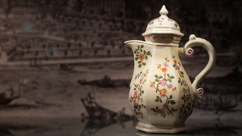 18th century ceramic coffee pot with painted flowers