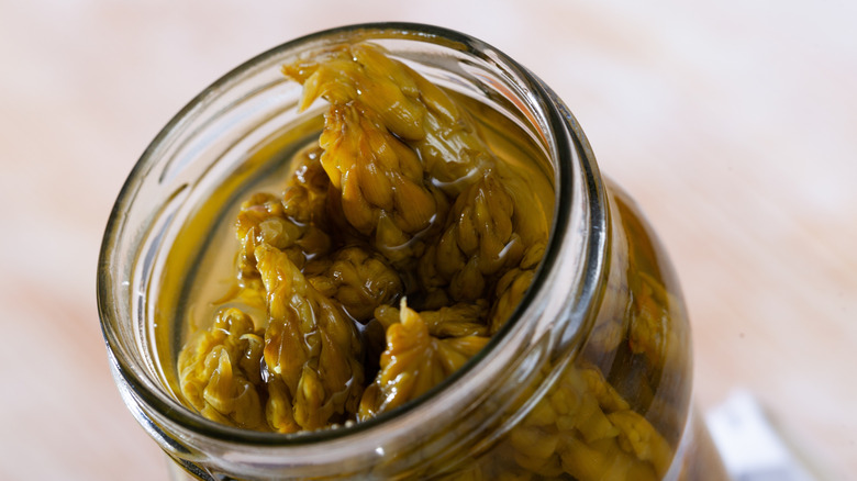 Pickled asparagus spears in a jar