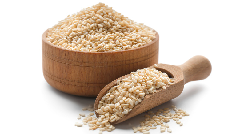 wooden spoon with sesame seeds