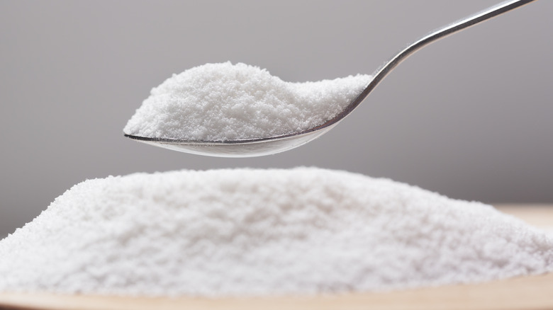 a spoonful of powdered sweetener