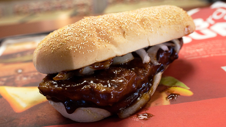 A close up on a McDonald's McRib sandwich