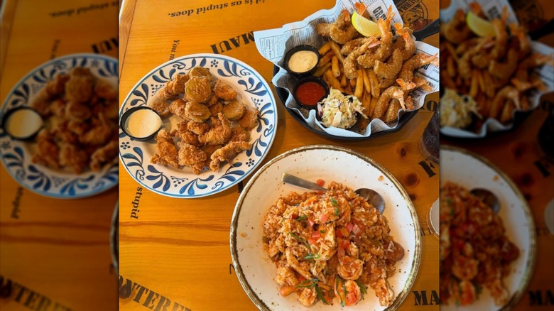 Three plates of fried and sauteed shrimp