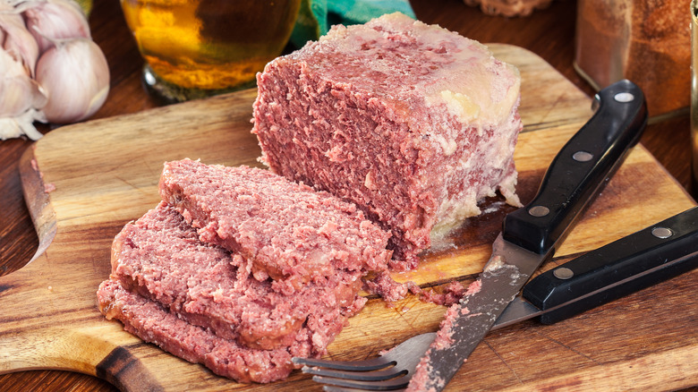 Canned corned beef on cutting board