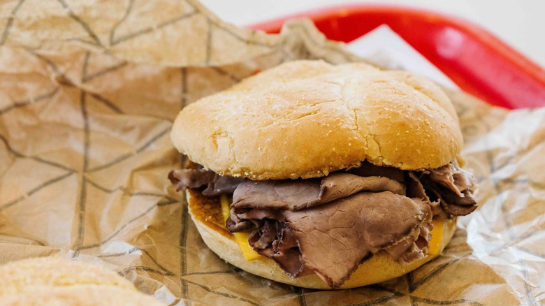 Roy Rogers roast beef sandwich with cheese on red tray