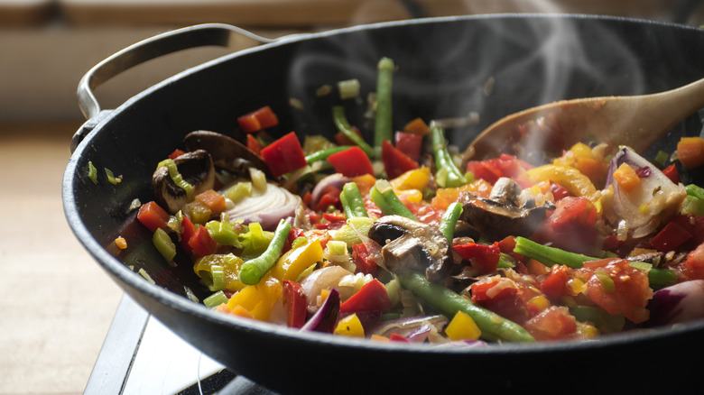 Closeup of sautéing stir fry vegetables in a pan