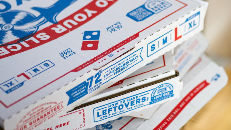 Domino's pizza boxes stacked