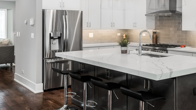 A row of stainless steel LG refrigerators