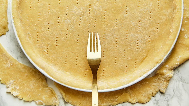poking pie crust with fork