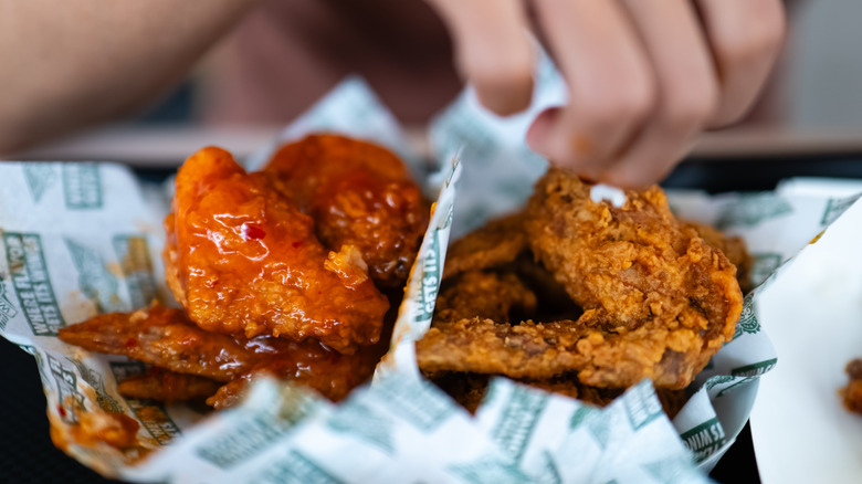 A close-up of Wingstop wings in a serving basket