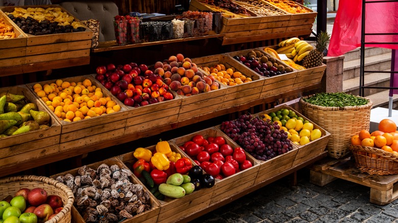 Fresh produce in wooden boxes at a market
