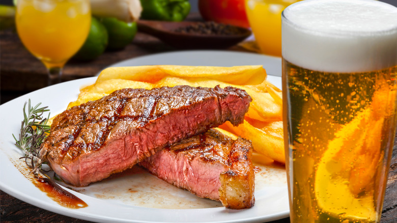 steak and beer on table