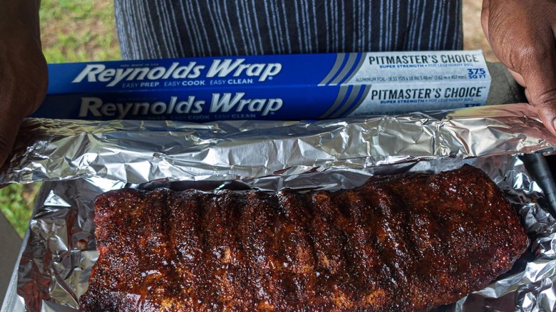 Grilled ribs in front of a box of Reyonds Wrap Pitmaster's Choice