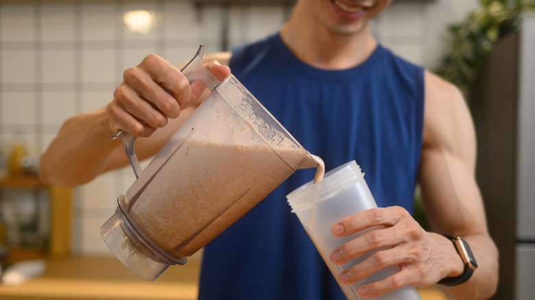 man drinking protein shake