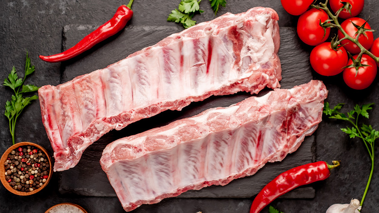 pork ribs with silver skin on cutting board