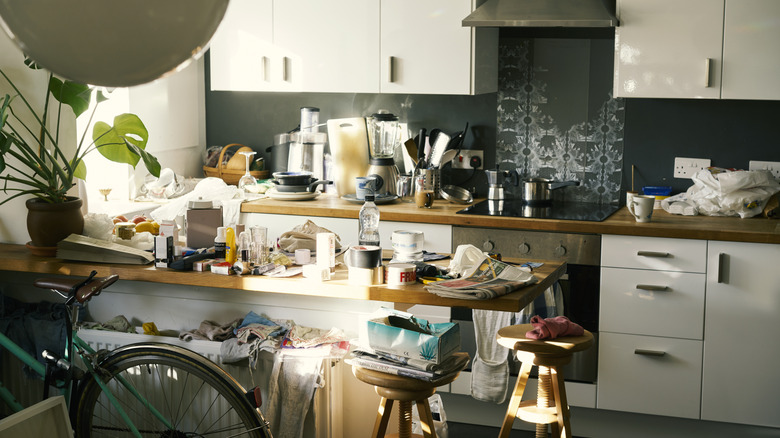 Cluttered kitchen with messy countertops