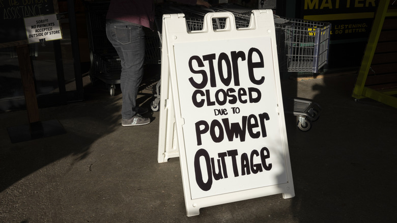 A fold-out painted sign reads 