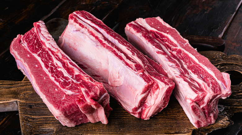 Three large, marbled, meaty short ribs