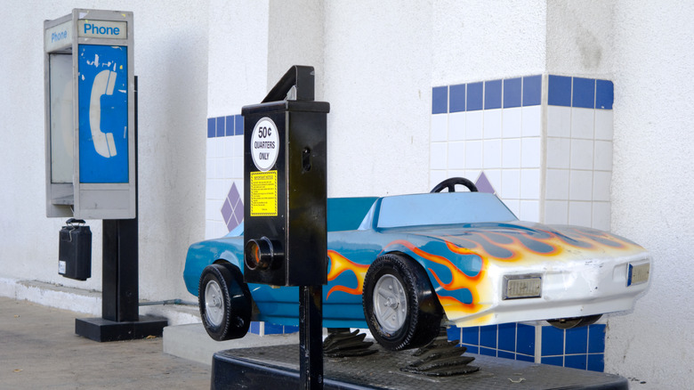 Coin-operated car ride outside of store