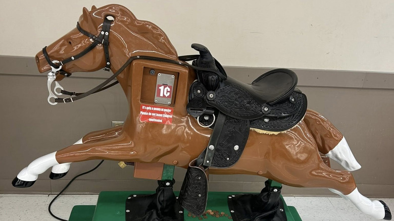 Sandy penny ride outside of a store