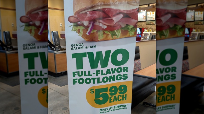 A sign announcing two Subway footlong sandwiches for $5.99 each