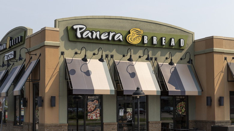 A Panera Bread location with blue and white awnings
