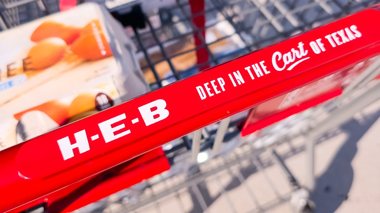 An H-E-B cart handle says deep in the cart of texas