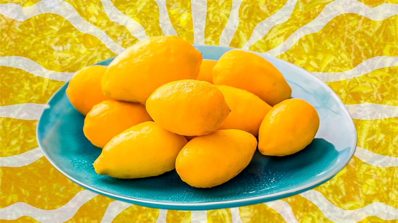 Plate of limequats on yellow background