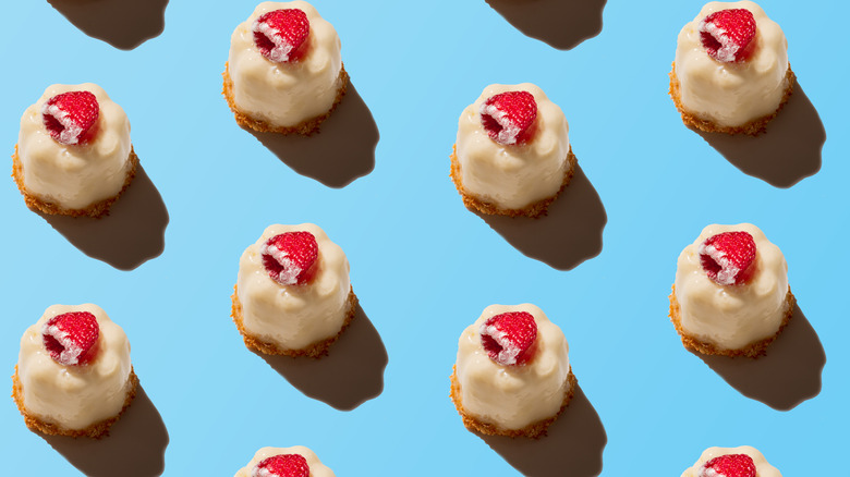 mini cream cakes with raspberries
