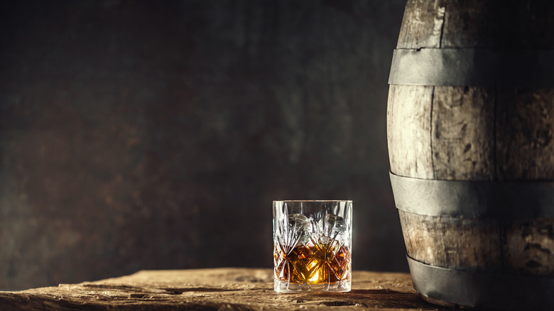 bourbon on ice with barrel