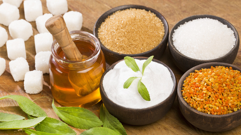 Variety of sweeteners in bowls and jars