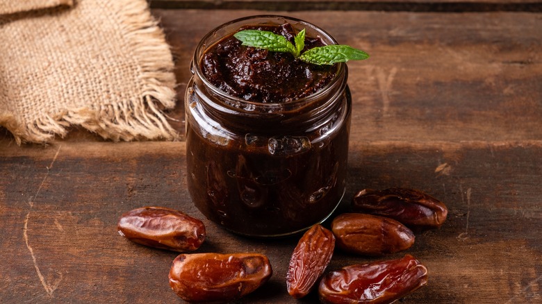 Date paste in jar next to whole dates