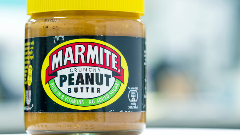 Jar of Marmite crunchy peanut butter close up