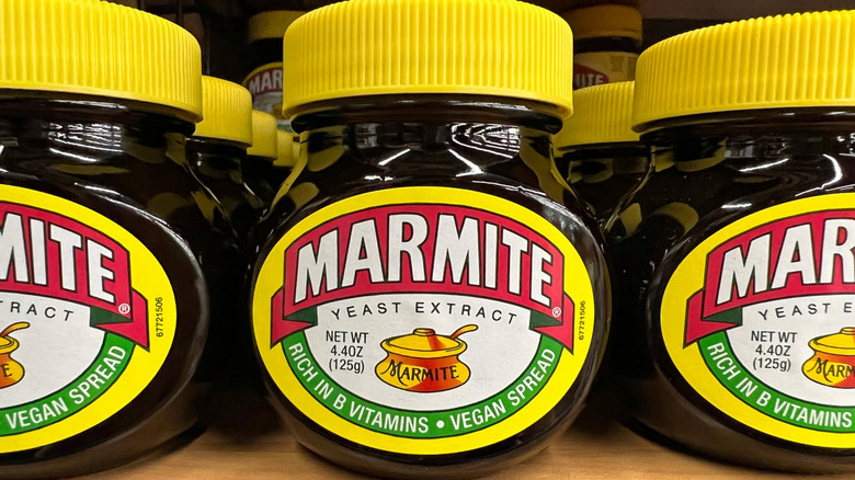 Multiple jars of Marmite on shelf