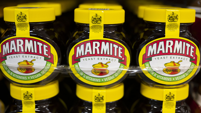 Jars of Marmite stacked on supermarket shelf