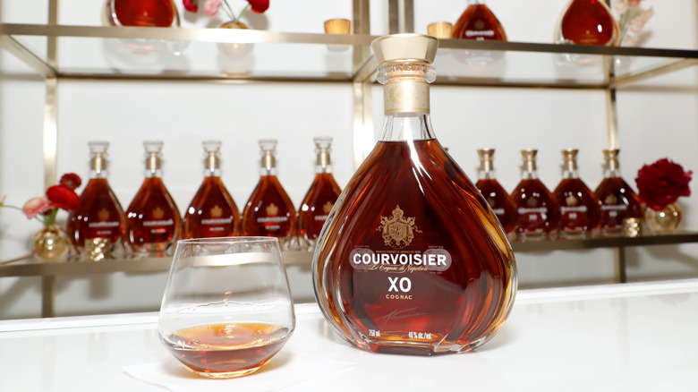 bottle and glass of courvoisier cognac