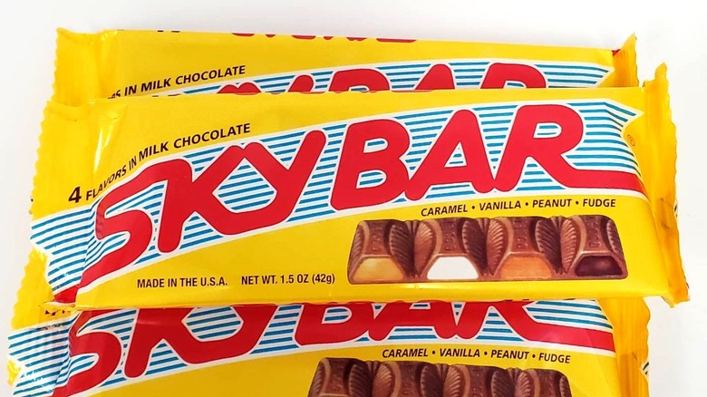 Sky Bar candy bars in wrappers against white background