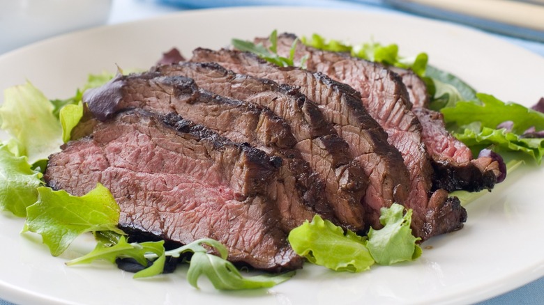 Plate of cooked and sliced ostrich steak