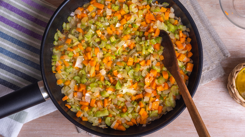 pan filled with sauteed carrots onions and celery