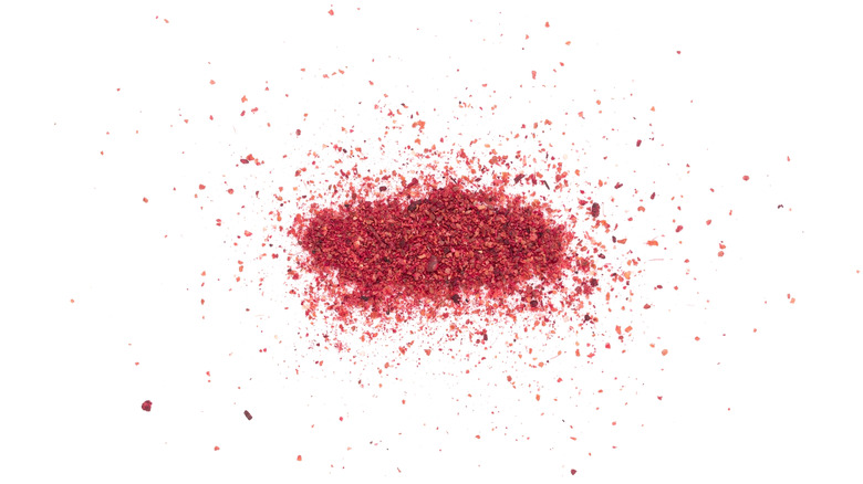 Sprinkle of sumac on white background