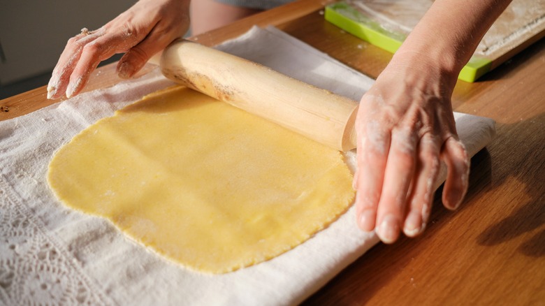 Hand rolling pasta dough