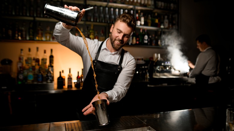 Bartender throwing cocktail