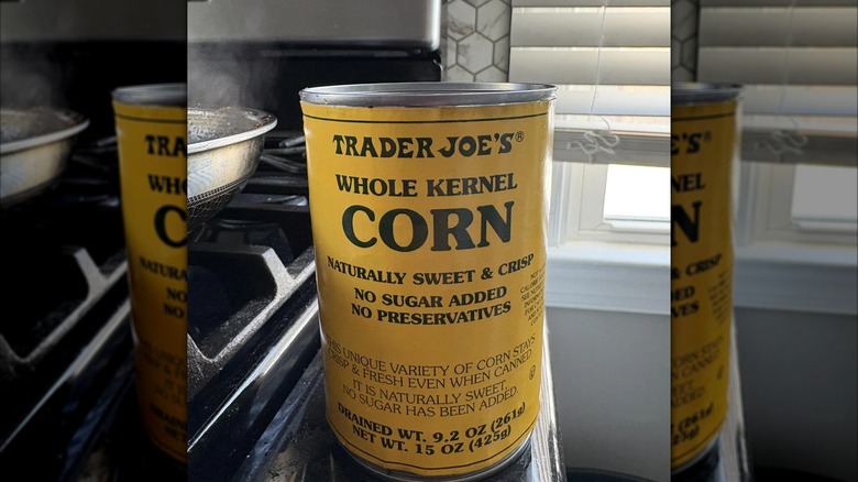 close up of canned corn in kitchen, mirrored image